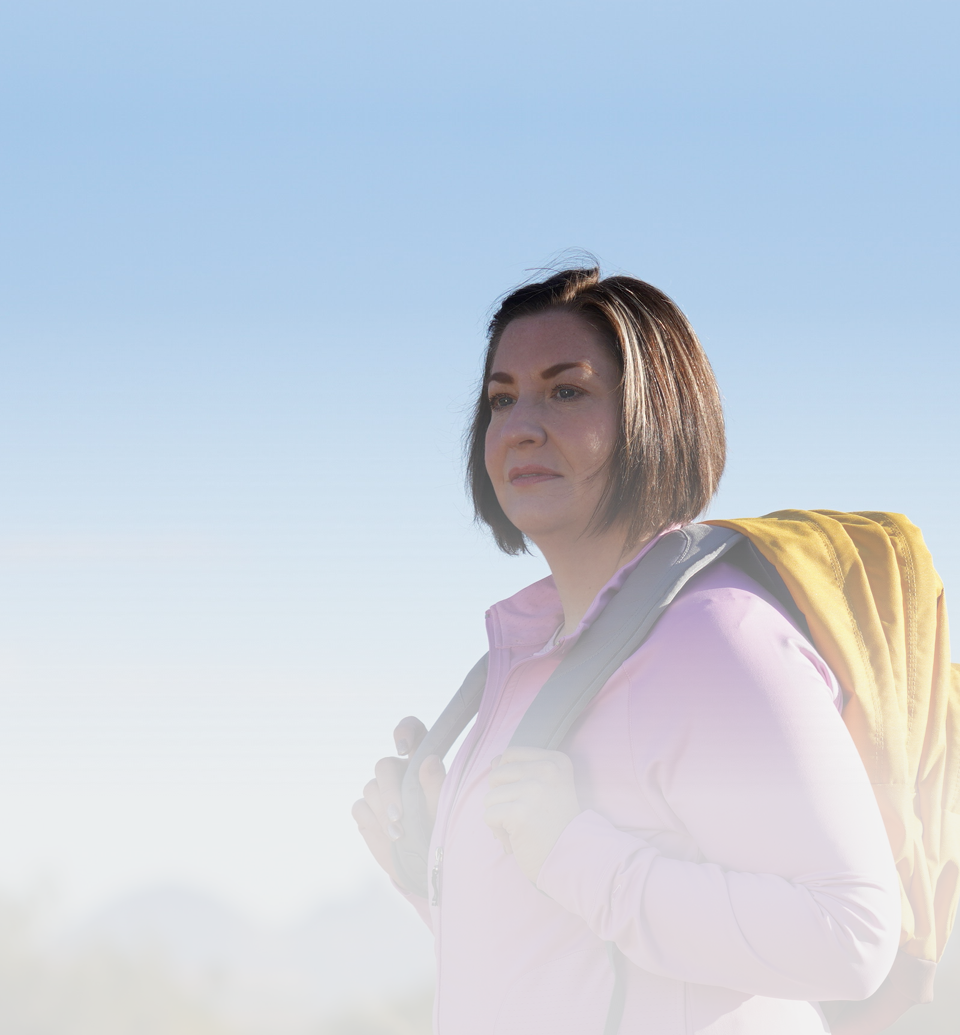 Acthar Gel patient: Brandi carrying backpack outdoors